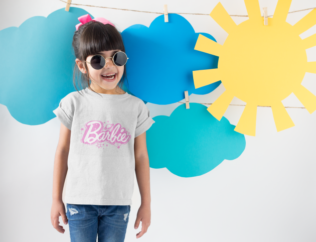 smiling-girl-wearing-a-round-neck-tshirt-template-near-cardboard-sun-and-clouds-a19480